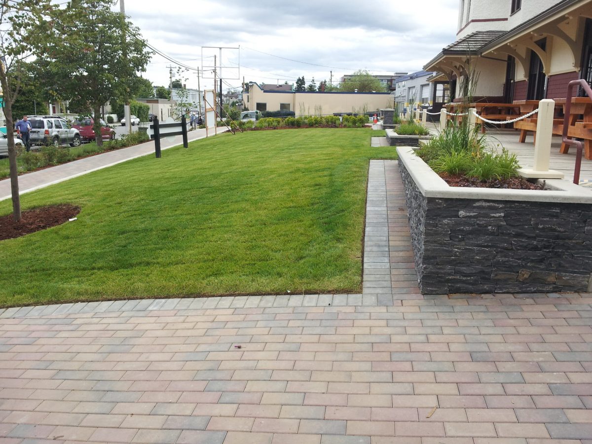 commercial lawns and stone planters
